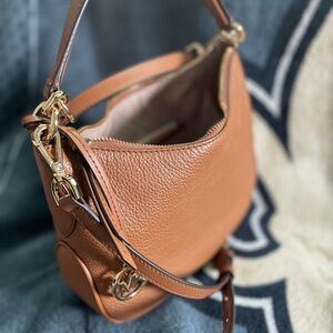 The Kelsey monogram small pouchette by Micheal Kors